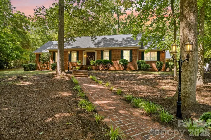 Come home to 150 Kent and enjoy the privacy and serenity of trees and large acreage in this custom brick home.