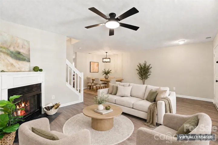 Open living and dining areas feature new LVP flooring, paint, and updated lighting
