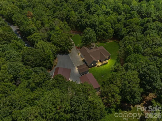This is the one that makes you stop scrolling. Set on +/- 10.5 private acres, this estate brings together the main residence, separate office building with half bath and storage, 3-bay shop, Boat/RV garage with additional storage, two separate driveways, gated entry, and room to live, work, store, create, and grow—all in one incredibly versatile property. If you’ve been looking for more than just a house, this is the kind of place that changes what “home” can look like.