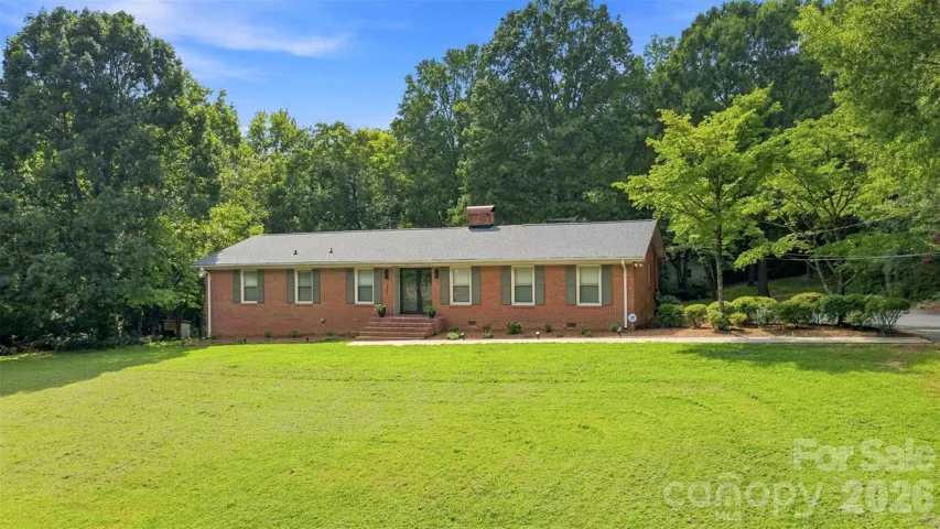 This lovely, all brick home is the perfect spot for a home-steader dream, only 1/2 mile from the local hospital, but with the feeling of wide-open country spaces! Bring your chickens and your dreams of a home garden!
