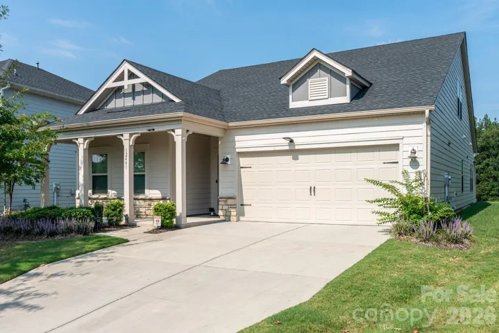 One and a half story home with spacious garage!