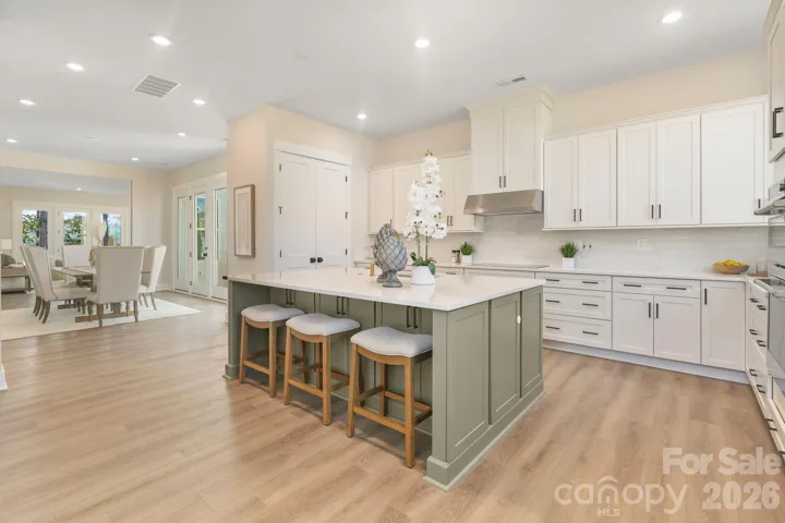 Large kitchen island with bar seating and pantry