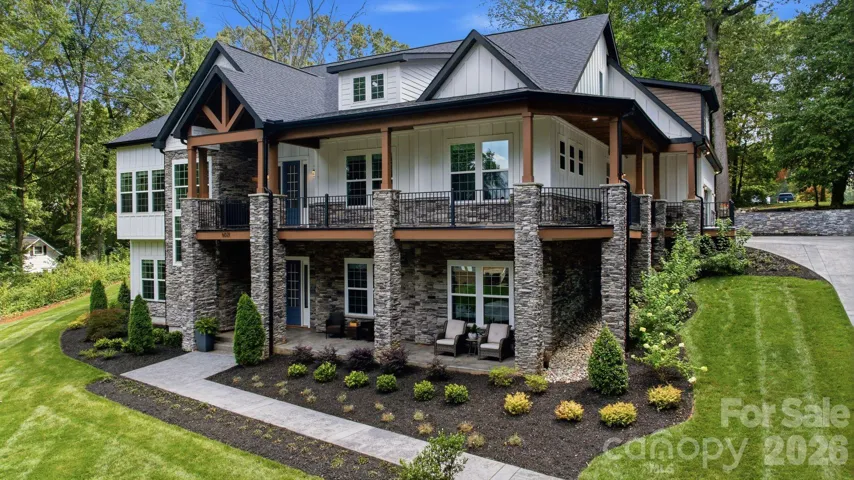 Welcoming front elevation with stone and architectural detailing