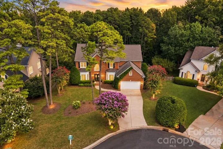 WELCOME HOME! 7337 Versailles Ln. An exceptional opportunity in prestigious Inverness at Piper Glen, where timeless architecture, gracious interiors, and refined indoor-outdoor living come together beautifully