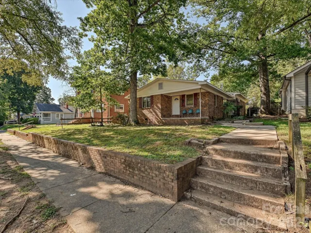 Charming all-brick duplex at 305 Keswick Avenue offering incredible investment potential, a spacious lot with mature trees, and a prime Charlotte location just minutes from Uptown and Camp North End.