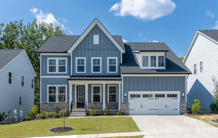Toll Brothers Ridgecrest home, built 2023, with stone-accented front elevation and covered porch