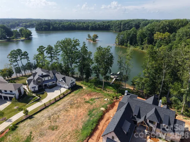 Level 0.61-acre homesite above a wide bay of Lake Wylie — views run north to northwest across open water.