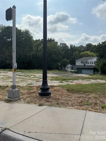 Concrete pad from previous convenience store that once occupied the lot.