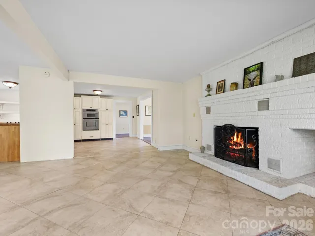 The heart of the home is a Great Room with doors leading out to the deck, a center cooking island, and a fireplace.
