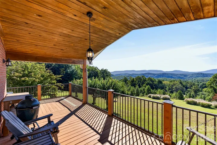 Off the back cathedral-covered porch, centered on the living room inside! Amazing natural light cascades through!