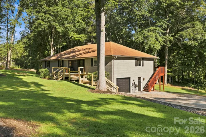 Lower-level garage and exterior access complement the home's versatile two-level layout.