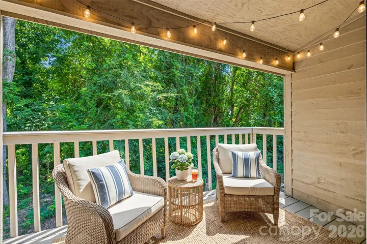 Virutally staged balcony off primary suite