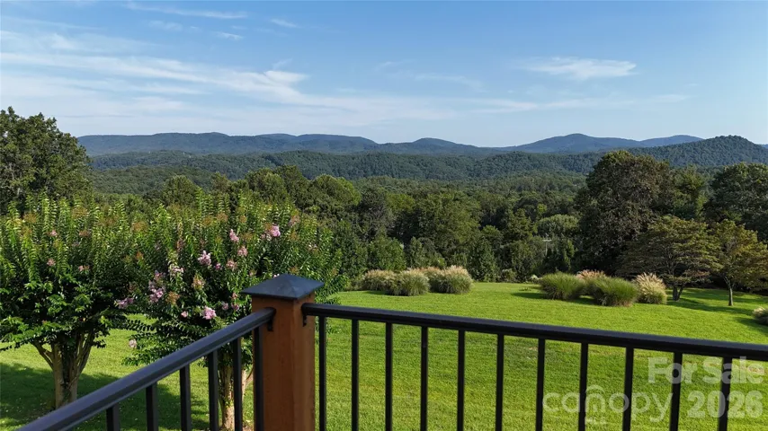 Wow! Rare and amazing mountain views right off your covered back porch or soak up the sun or play in the rain on the uncovered section! LOL