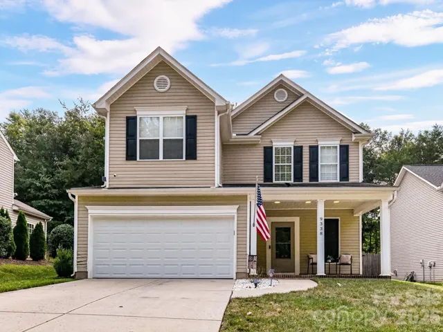 Charming two-story Charlotte home in the desirable Kingstree community featuring a two-car garage and welcoming covered front porch.