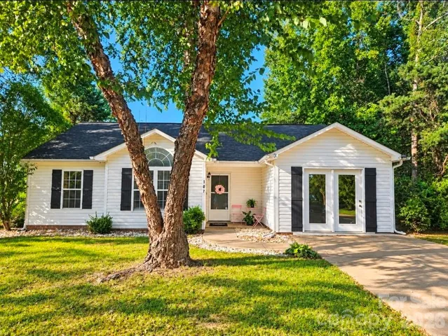 Welcome to 107 E Panther Creek Rd—one-level living on approximately .52 acre with mature trees and NO HOA!