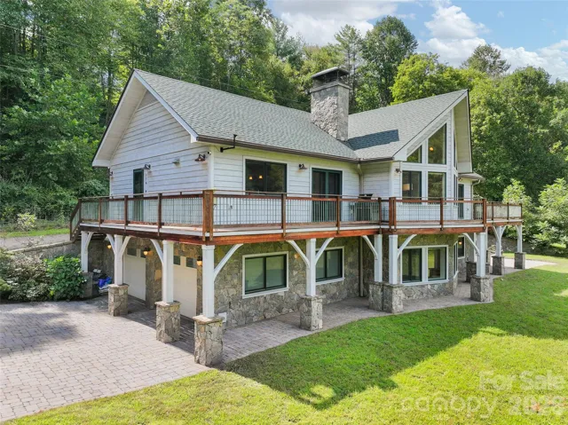 Welcome to 174 Marina Cove—a private 5.02 -acre estate, pond and exceptional outdoor living.