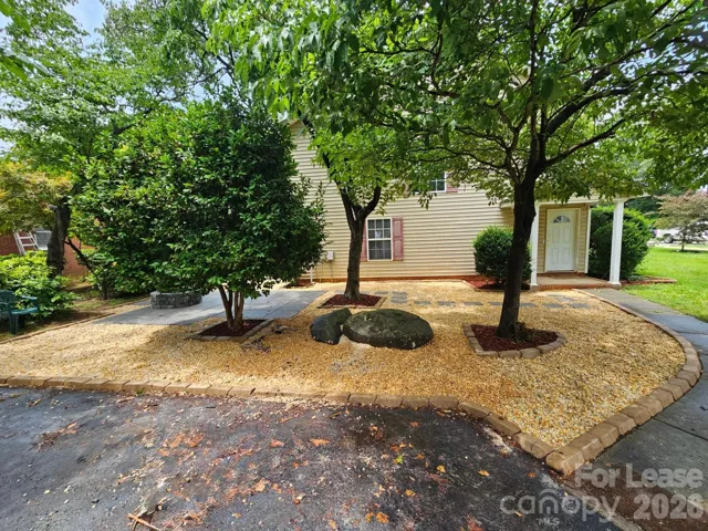 Tree-lined, landscaped front