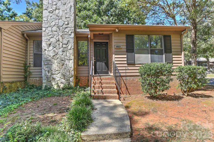 1023 Cranberry Circle in Dogwood Hills is an end unit located on the corner of Cranberry & Sweetgum.