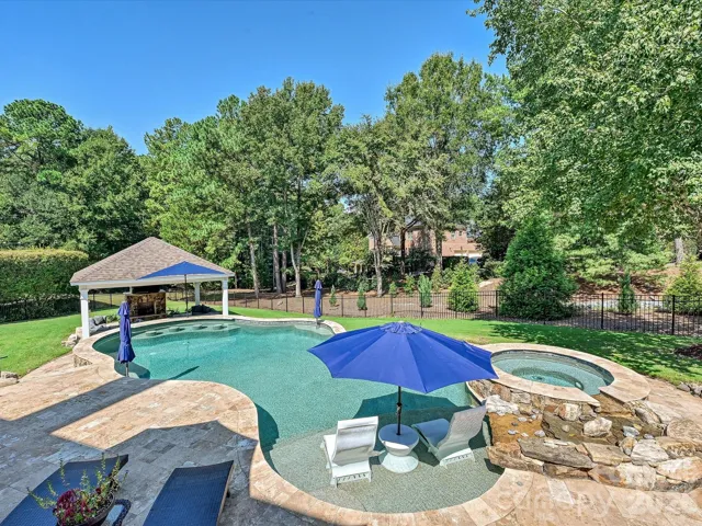 Backyard Oasis - pool, spa with water feature, swim up bar with seats, umbrella sleeves, travertine pool deck, cabana