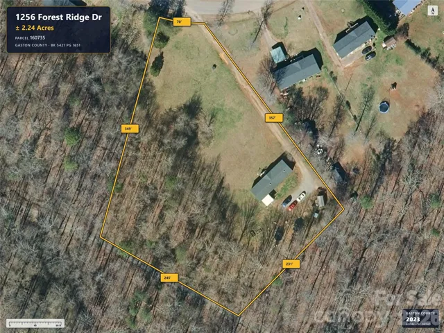 Aerial imagery predates removal of the previous home.