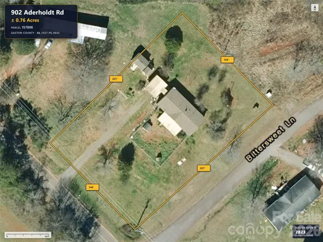 Aerial imagery predates removal of the previous home.