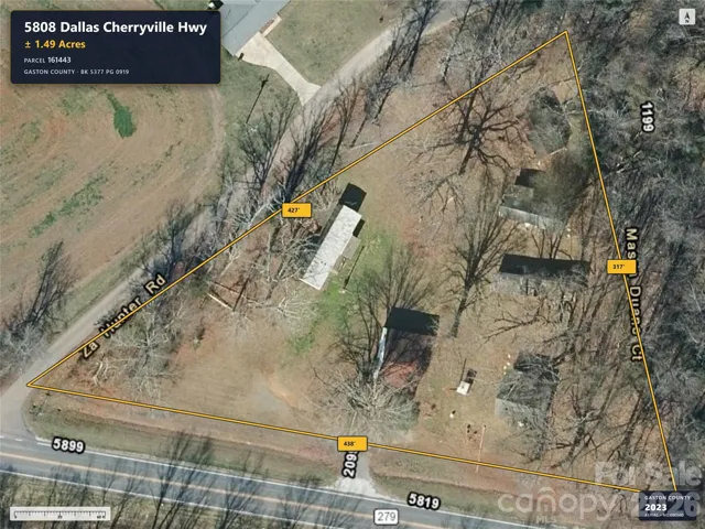 Aerial imagery predates removal of the previous home.