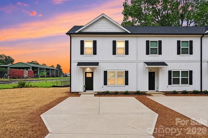 Brand-new corner townhome with fresh curb appeal.