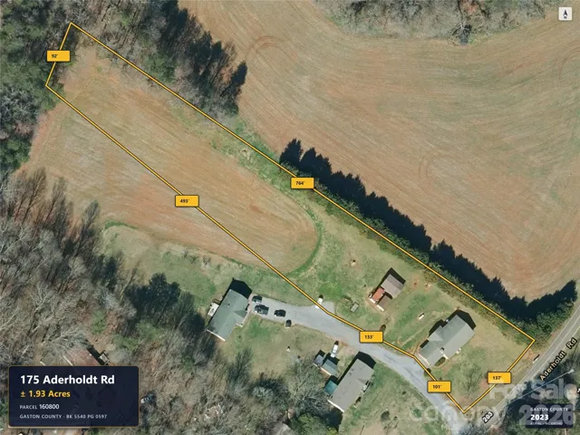 Aerial imagery predates removal of the previous home.
