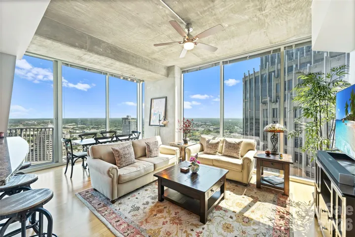 34th-floor sub penthouse corner residence with walls of glass and expansive views