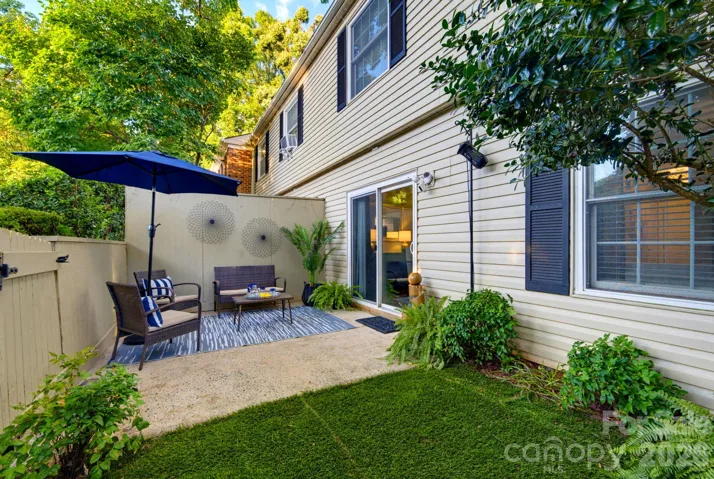 A private, garden-style patio offers an inviting extension of the home for outdoor living and entertaining.