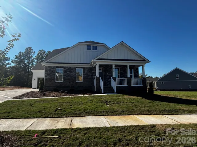 Homesite 13 features a Harrison E floorplan with Two Car Garage and Utility Garage
