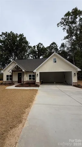 Pearl colored siding and brown trim. Garage door will be brown.