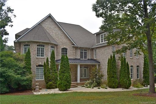 Full brick home in Stutts Cove on Lake Norman. Front elevation. Driveway to the right.