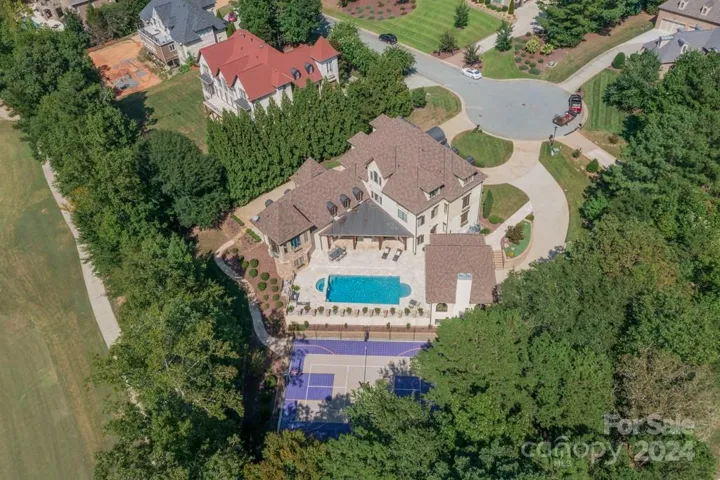 This luxurious estate sits on almost 3/4 of an acre with privacy and golf course accessibility.