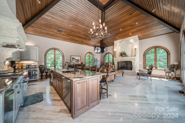 Cabana: Commercial grade kitchen. Large gas fireplace. Two large screen TVs; one in each corner.