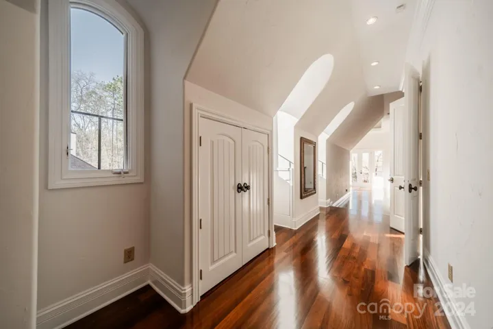 Primary suite foyer with Walk-In closet through pocket door to the right (not shown).  Freshly painted.