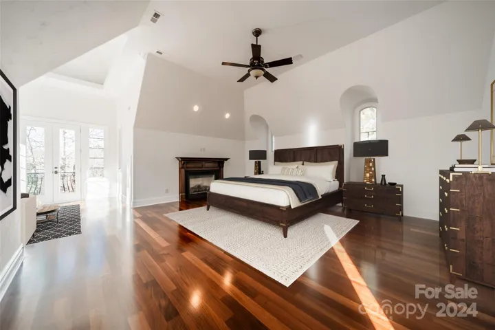 Primary bedroom with gas fireplace. Freshly painted. (Virtually staged.)