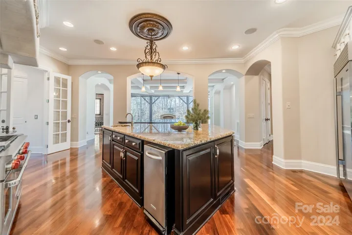 Kitchen views looking out over at the private terrace. French doors to foyer. Mud room to the right.