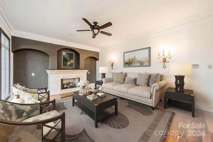 Front Living Room w/ gas fireplace & freshly painted. Virtually staged.
