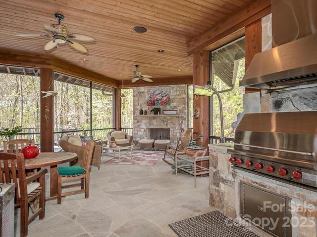 Screened in porch-grilling station-fireplace