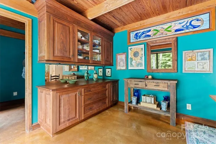 Kitchen (1) cabinetry and custom stained glass in main house.
