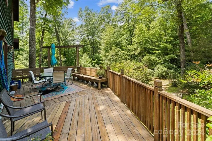 Beautiful deck off of kitchen (1) in main house overlooking the back yard.
