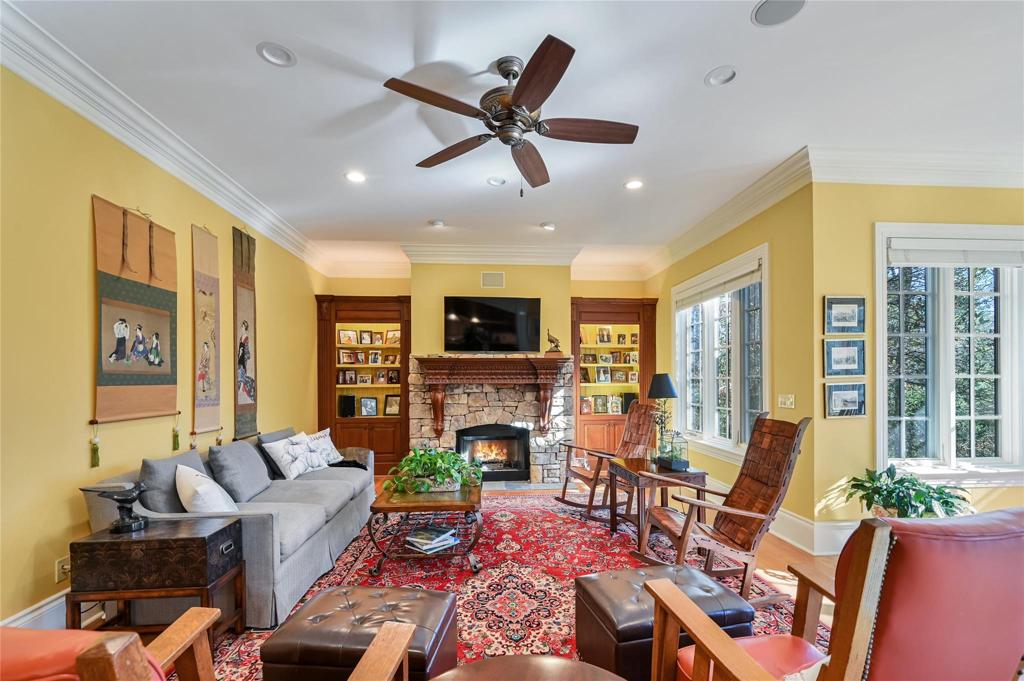 Den with fireplace open to breakfast area and open to kitchen