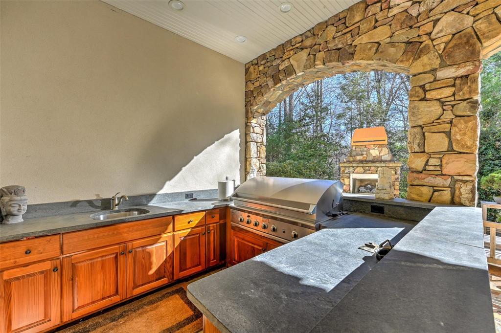Covered grill area with sink on lower level