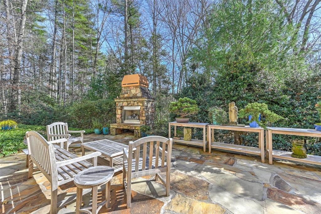 Lots of outdoor seating around the wood burning fireplace with gas ignitor.