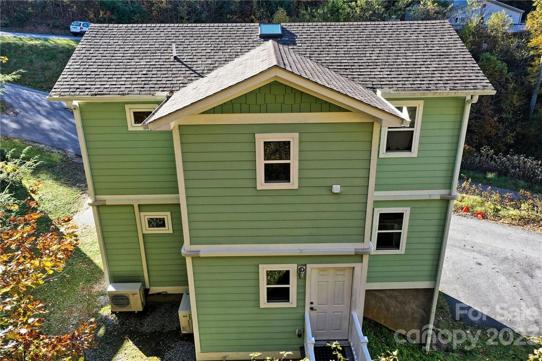 Drone photo back of house with entry to main level
