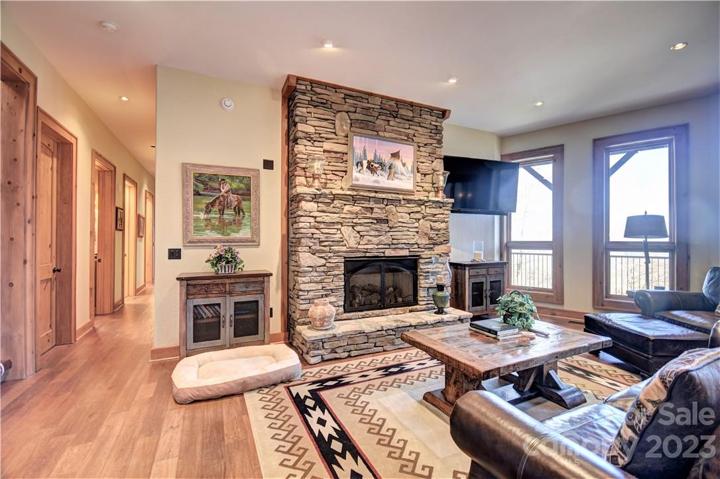Lower-level family room with a propane gas log fireplace