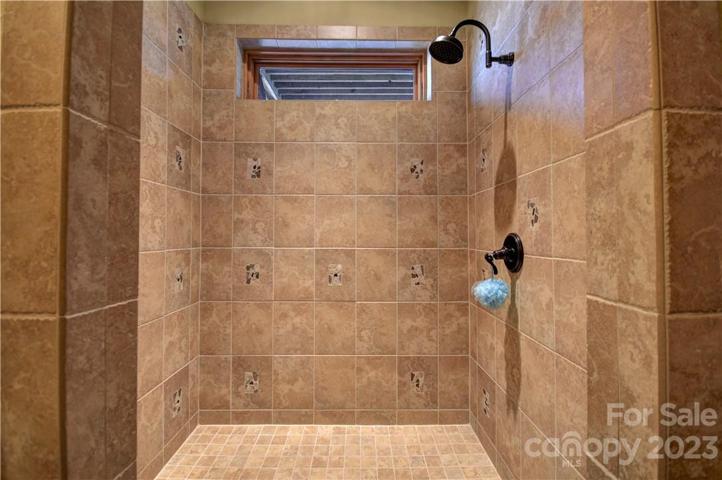 Walk-in tiled shower off bath 4