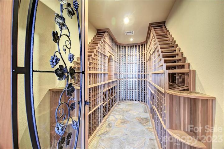 Wine Cellar off the family room with ample slots and beautiful entry door