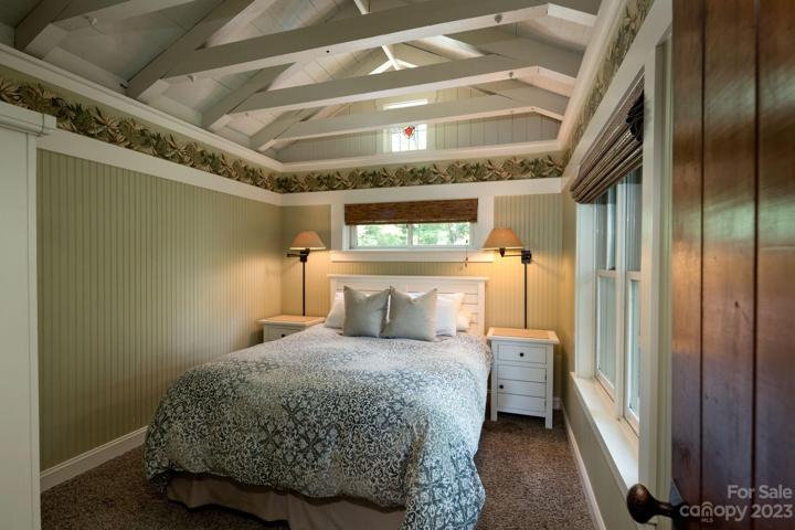 Cottage bedroom with charming beam ceiling accents